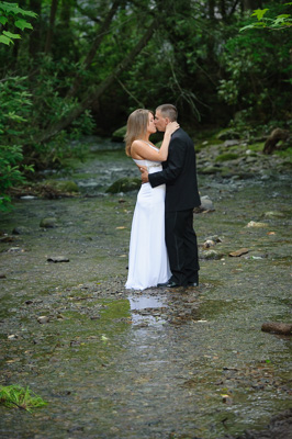 Outdoor elopement under a waterfall